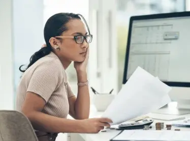 An actress filing her taxes and working on determining her tax deductions.