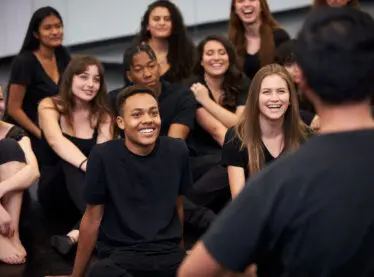 Acting students listening to their teacher, who is also a casting director.