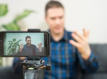 An actor recording his self tape with our items from our list.