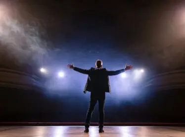 An actor making a powerful entrance to the stage. He learned many tips in order to perfect his performance.