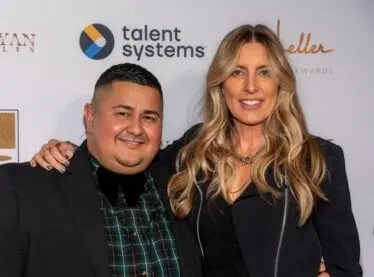 Talent agent Milton Perea at an awards show with a friend.