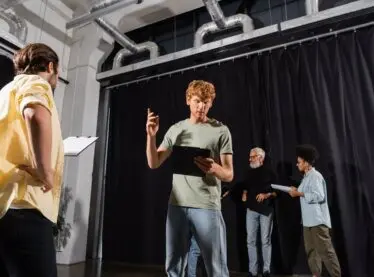 Two students in an acting class rehearsing their lines.