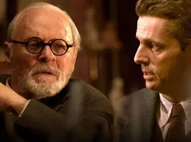 Anthony Hopkins and Matthew Goode in suits for 'Freud's Last Session.'
