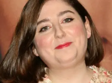 Screenwriter and casting director Samy Burch at the May December premiere smiling in a in a floral dress.