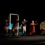 Various stage actors performing in a play.