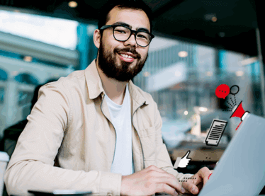 A commercial actor on a laptop in an office following up on a callback email.