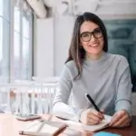 An actress jotting down multiple ways to impress a director.