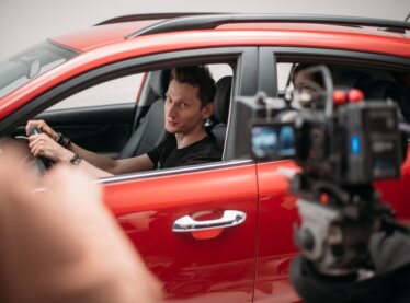 A commercial actor keeping it professional on set.