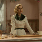 Brie Larson in a white 1950s shirt in the kitchen cooking.